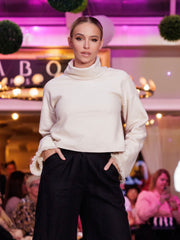 Fashion model in organic cotton turtleneck sweater made by Czcuz Studio ctothing brand